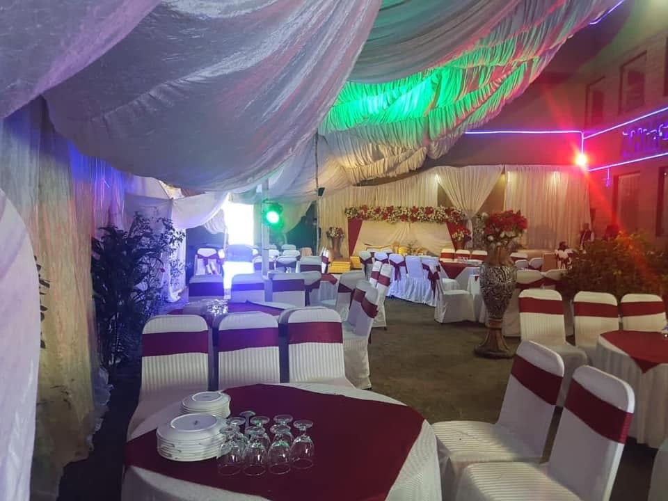Wide view of the marquee at Ahmed Palace with draped ceiling and covered seating